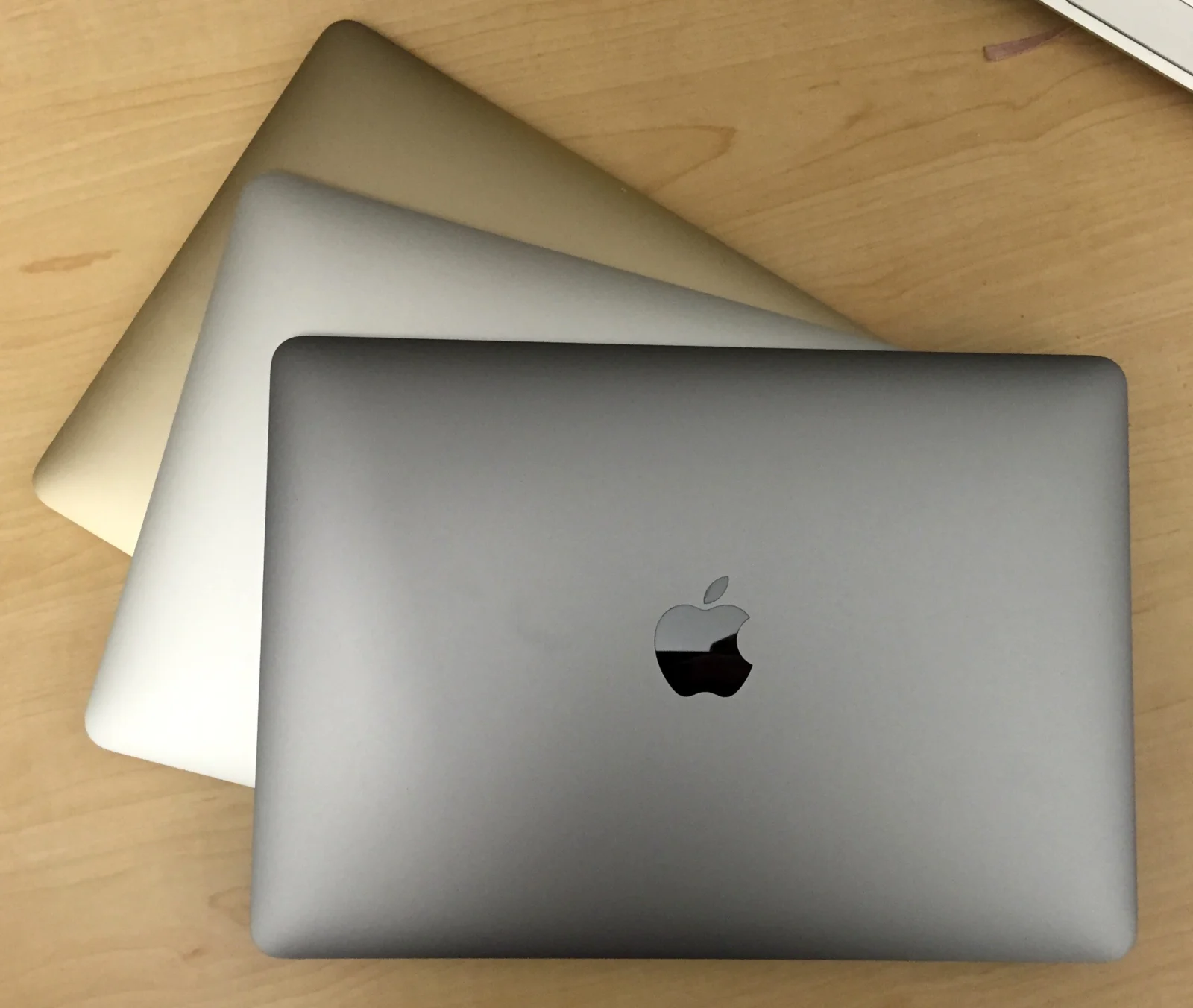 Closed 12-inch Retina MacBooks in different colours