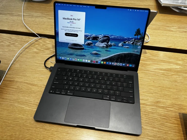 Space black 14-inch MacBook Pro open on a desk